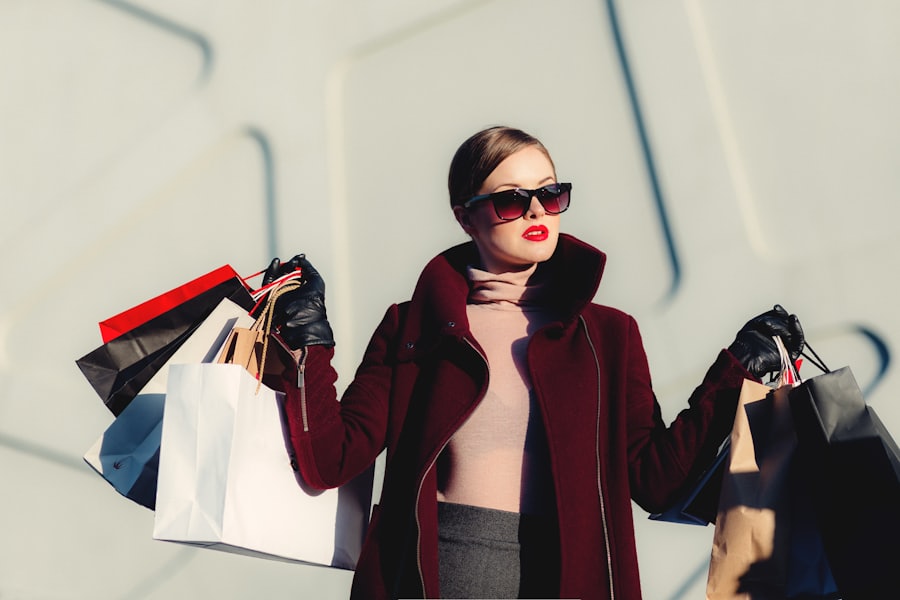 Model in a contemporary autumn look carrying shopping bags