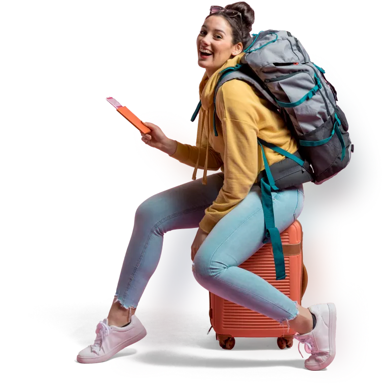 Traveller with a backpack sitting on a suitcase, ready for an adventure